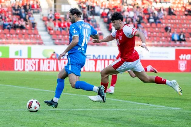 Regionalliga Northeast, Season 26-27: Hallescher FC vs. SV Tasmania Berlin, Halle, Germany, September 2, 2026. Pictured from left: Abdulkadir Beyazit (Tasm Berlin) and Burim Halili (Halle), Halle Saale Leuna Chemie Stadium, Saxony-Anhalt, Germany