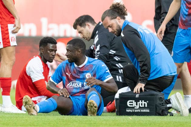 Regionalliga Northeast, Season 26–27: Hallescher FC vs. SV Tasmania Berlin, Halle, Germany, September 2, 2026. Pictured, from left: Bocar Baro (Halle) and Jamilu Collins (Tasm Berlin). Injured, injury, pain, Halle Saale Leuna Chemie Stadium, Saxony-Anhalt, Germany