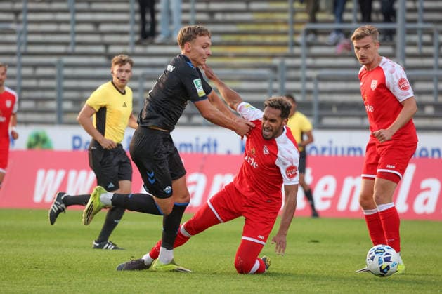 Julius Bugenhagen (PB, left) vs. Kevin Goden (SI, right) — Regionalliga West soccer, Matchday 6, Sportfreunde Siegen vs. SC Paderborn 07 U21, on September 2, 2026, in Siegen, Germany