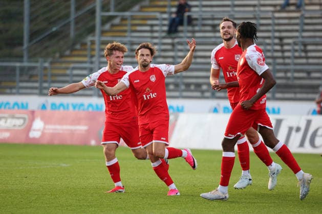 Lucas Cueto (No. 2 from the left) celebrates his goal, making the score 1–0, in the Regionalliga West soccer match between Sportfreunde Siegen and SC Paderborn 07 U21, Matchday 6, on September 2, 2026, in Siegen, Germany