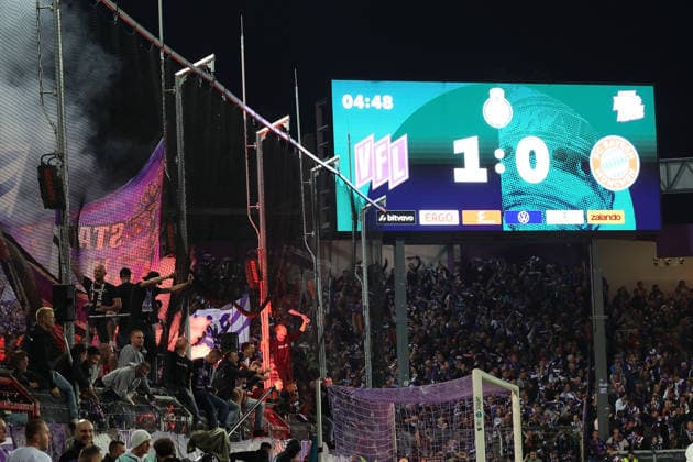 September 2, 2026, xrekx, Soccer DFB Cup 1st Round, VfL Osnabrück vs. FC Bayern Munich – fans, spectators, ultras, atmosphere, flags, jerseys, VC, Violet Crew setting off pyrotechnics, flares, smoke, fog, fireworks, scoreboard in Osnabrück