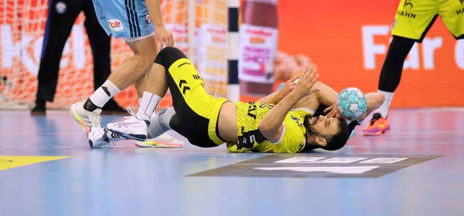Photo: Elias KOFLER (Hamburg) performing a floor acrobatic move against Mohamed Amine DARMOUL (Stuttgart) – Men s Handball 1st Bundesliga, Matchday 2, Wed, Sept. 2, 2026 – Handball 1st League: HCH Hamburg vs. TVB Stuttgart 34–34