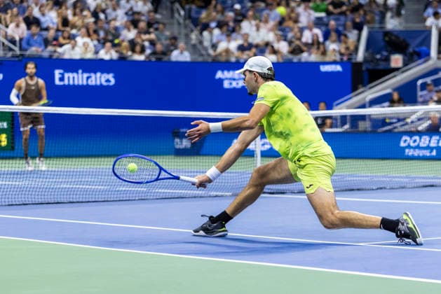 Jaime Faria of Portugal returns a ball to Carlos Alcaraz of Spain in the first set of their second round match in Arthur Ashe Stadium at the 2026 US Open Tennis Championships at the USTA Billie Jean King National Tennis Center in New York City on Wednesday, September 2, 2026.  NYP20260902322 COREYxSIPKIN