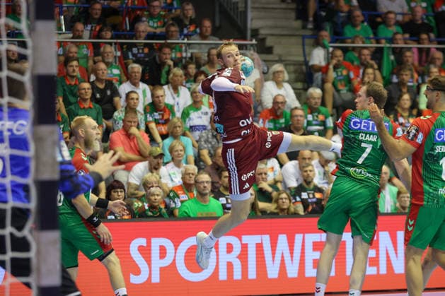 September 3, 2026, xtgx, Opel HBL Handball, SC Magdeburg vs. Füchse Berlin emspor, from left: Mathias Gidsel (Berlin), 19, takes a shot, goal scorer, scores a goal, Magdeburg