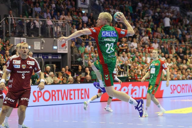 September 3, 2026, xtgx, Opel HBL Handball, SC Magdeburg vs. Füchse Berlin emspor, from left: Magnus Saugstrup (Magdeburg), 23, takes a shot, goal scorer, scores a goal, Magdeburg