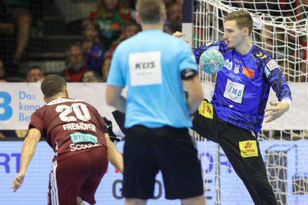 September 3, 2026, xtgx, Opel HBL Handball, SC Magdeburg vs. Füchse Berlin emspor, from left: Tim Freihöfer (Berlin), 20. Dominik Kuzmanovic (Magdeburg), 1 save, holds the ball, catches the ball, saves a seven-meter throw for Magdeburg