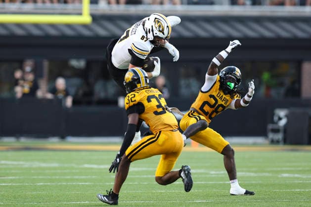 COLUMBIA, MO - SEPTEMBER 03: Brett Norfleet 87 of the Missouri Tigers leaps high to try and go over Camare Jackson 28 and Azayvonne Stribling 32 of the Arkansas-Pine Bluff Golden Lions in the first quarter of a college football game between the Arkansas-Pine Bluff Golden Lions and Missouri Tigers on Sep 3, 2026 at Memorial Stadium in Columbia, MO. (Photo by Scott Winters Icon Sportswire) COLLEGE FOOTBALL: SEP 03 Ark.-Pine Bluff at Missouri EDITORIAL USE ONLY Icon2609030012