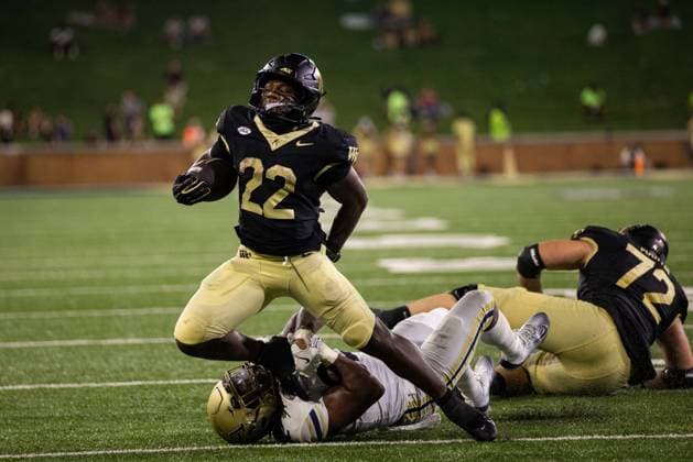 September 3, 2026: Wake Forest Demon Deacons running back Deuce Lawrence (22) gets tackled by Akron Zips linebacker Donelius Johnson (32) during the second half of the NCAA, College League, USA football match up at Allegacy Stadium in Winston-Salem, NC. Mandatory Credit: -Cal Media Winston-Salem United States - ZUMAc04_ 20260903_zma_c04_077 Copyright: xScottxKinserx