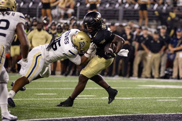 NCAA, College League, USA Football 2026: Akron At Wake Forest Sep 03 September 3, 2026: Wake Forest Demon Deacons running back Deuce Lawrence (22) powers into the end zone against Akron Zips linebacker Devin Reeves (45) during the second half of the NCAA football match up at Allegacy Stadium in Winston-Salem, NC. Mandatory Credit: Scott Kinser-Cal Media (Credit Image: Â Scott Kinser Cal Sport Media) Winston-Salem Nc United States EDITORIAL USE ONLY Copyright: xx ZUMA-20260903_zma_c04_078.jpg ScottxKinserx csmphotothree516542