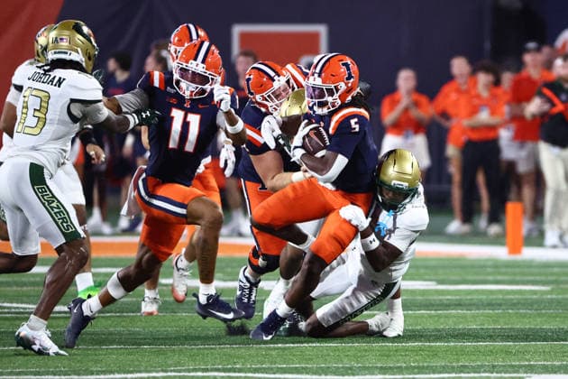 September 3, 2026, Champaign, Illinois, USA: CA LIL VALENTINE 5 for the Fighting Illini gets stopped by a pair ofd defenders In first half action of the University of Illinois Fighting Illini football hosting University of Alabama at Birmingham Blazers. Champaign USA - ZUMAl176 20260903_znp_l176_002 Copyright: xAlanxLookx