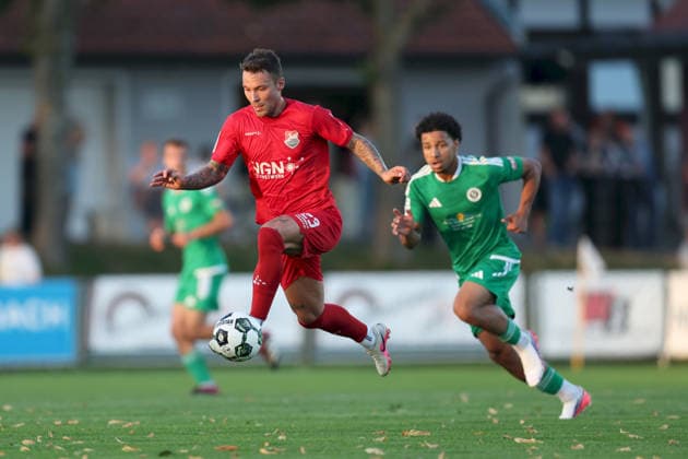 September 4, 2026, Men s, Soccer, 2026–2027 season, Bavarian Regional League, Matchday 7: TSV Aubstadt vs. SpVgg Ansbach; Ingo Feser (23), TSV Aubstadt, and Tyron Koomson (20), SpVgg Ansbach; Sulzfeld Schulstadion, Aubstadt; NGN Arena, Bavaria, Germany