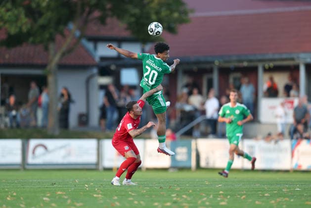 September 4, 2026, Men s, Soccer, 2026–2027 season, Bavarian Regional League, Matchday 7: TSV Aubstadt vs. SpVgg Ansbach; Ingo Feser (23), TSV Aubstadt, and Tyron Koomson (20), SpVgg Ansbach; Sulzfeld School Stadium, Aubstadt; NGN Arena, Bavaria, Germany