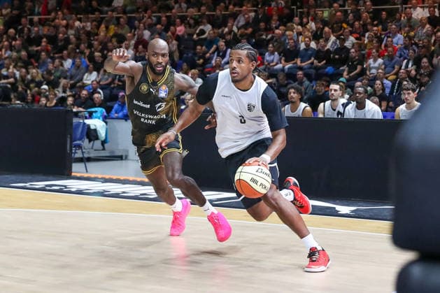 September 4, 2026, xgox, Basketball Exhibition Game: Basketball Loewen Braunschweig vs. Bamberg Baskets, emspor, from left: Sheldon Edwards (Braunschweig), 13, Jordan Wright (Bamberg), 3; duel, battle, tackle, Braunschweig