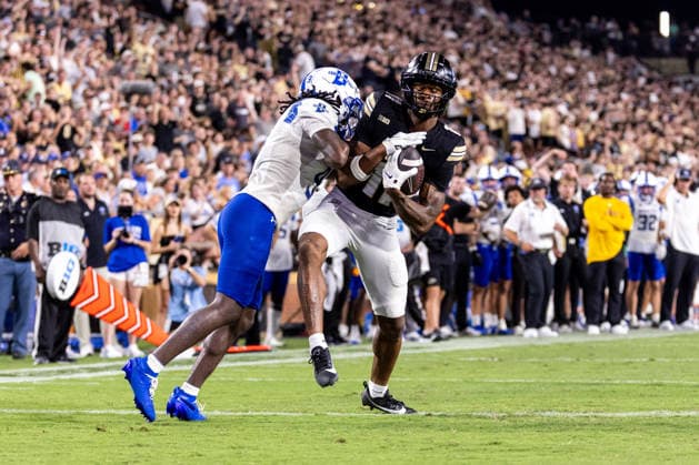 Sep 04, 2026; West Lafayette, Indiana, USA; Purdue wide receiver Tra Mar Harris (11) scores touchdown as Indiana State defender pursues during NCAA, College League, USA football game action between the Indiana State Sycamores and the Purdue Boilermakers at Ross-Ade Stadium in West Lafayette, Indiana. Mandatory Credit: -Cal Media NCAA Football 2026: Indiana State Vs Purdue SEP 04  - ZUMAc04_ 20260904_zma_c04_033 Copyright: xJohnxMersitsx