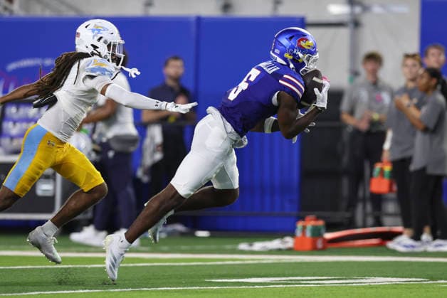 LAWRENCE, KS - SEPTEMBER 04: Nik McMillan 5 of the Kansas Jayhawks reaches out to make a 46-yard reception in the second quarter of a college football game between the Long Island Sharks and Kansas Jayhawks on Sep 4, 2026 at David Booth Memorial Stadium in Lawrence, KS. (Photo by Scott Winters Icon Sportswire) COLLEGE FOOTBALL: SEP 04 LIU at Kansas EDITORIAL USE ONLY Icon2609040392