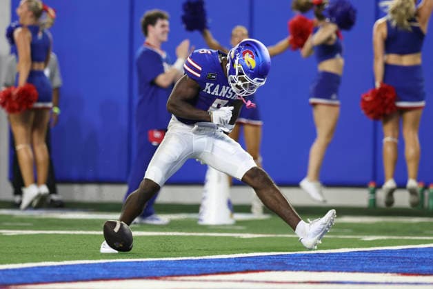 LAWRENCE, KS - SEPTEMBER 04: Nik McMillan 5 of the Kansas Jayhawks flexes to celebrate after making a 46-yard reception in the second quarter of a college football game between the Long Island Sharks and Kansas Jayhawks on Sep 4, 2026 at David Booth Memorial Stadium in Lawrence, KS. (Photo by Scott Winters Icon Sportswire) COLLEGE FOOTBALL: SEP 04 LIU at Kansas EDITORIAL USE ONLY Icon2609040410
