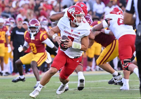 LOS ANGELES, CA - SEPTEMBER 04: Fresno State Bulldogs quarterback Jayden Mandal (7) rolls out of the pocket during the game between the USC Trojans and the Fresno State Bulldogs on September 04, 2026 at Los Angeles Memorial Coliseum in Los Angeles. (Photo by David Dennis Icon Sportswire) COLLEGE FOOTBALL: SEP 04 Fresno State at USC EDITORIAL USE ONLY Icon26090410
