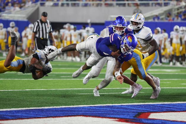 LAWRENCE, KS - SEPTEMBER 04: Isaiah Marshall 8 of the Kansas Jayhawks dives into the end zone for a touchdown in the third quarter of a college football game between the Long Island Sharks and Kansas Jayhawks on Sep 4, 2026 at David Booth Memorial Stadium in Lawrence, KS. The play was nullified due to a holding penalty. (Photo by Scott Winters Icon Sportswire) COLLEGE FOOTBALL: SEP 04 LIU at Kansas EDITORIAL USE ONLY Icon2609040603