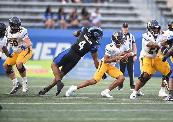 ATLANTA, GA - September 04: North Carolina A&T Aggies QB Kevin White Jr. (0) avoids a sack by Georgia State Panthers DE Xavier Esqillion (4) during game between the North Carolina A&T Aggies and the Georgia State Panthers on September 4, 2026 at Center Parc Credit Union Stadium in Atlanta, GA. (Photo by John Rivera Icon Sportswire) COLLEGE FOOTBALL: SEP 04 NC A&T at Georgia State EDITORIAL USE ONLY Icon426260904003