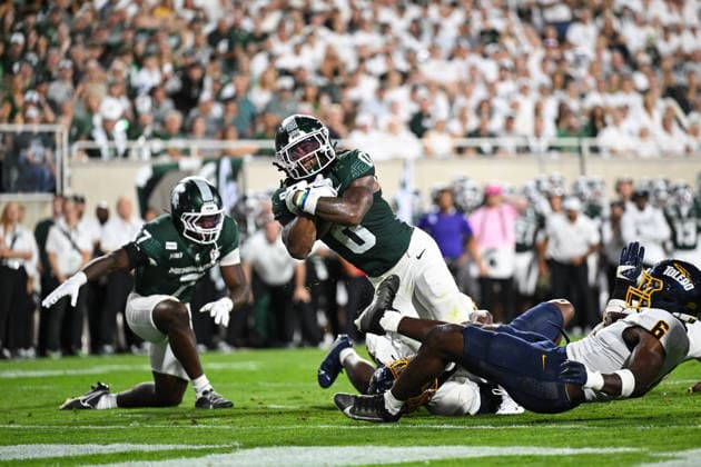 EAST LANSING, MI - SEPTEMBER 04: Michigan State Spartans running back Cam Edwards (0) lunges for the end zone during a college football game between the Michigan State Spartans and Toledo Rockets on September 4, 2026 at Spartan Stadium in East Lansing, MI. (Photo by Adam Ruff Icon Sportswire) COLLEGE FOOTBALL: SEP 04 Toledo at Michigan State EDITORIAL USE ONLY Icon260908009