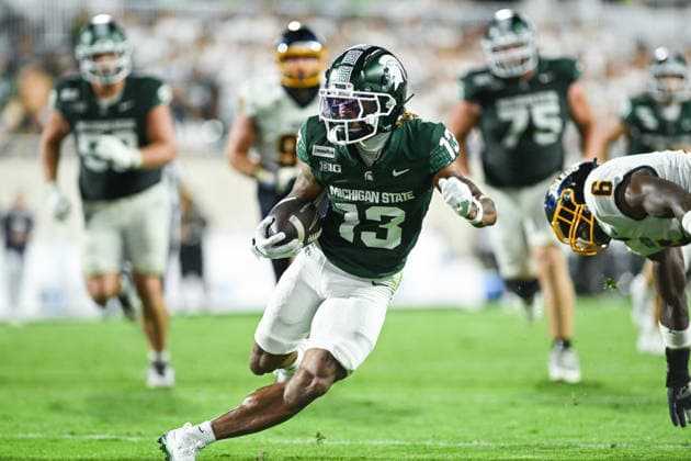 EAST LANSING, MI - SEPTEMBER 04: Michigan State Spartans wide receiver Chrishon McCray (13) twists past a tackle attempt during a college football game between the Michigan State Spartans and Toledo Rockets on September 4, 2026 at Spartan Stadium in East Lansing, MI. (Photo by Adam Ruff Icon Sportswire) COLLEGE FOOTBALL: SEP 04 Toledo at Michigan State EDITORIAL USE ONLY Icon260908021