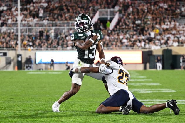 EAST LANSING, MI - SEPTEMBER 04: Michigan State Spartans wide receiver Chrishon McCray (13) gets stood up by Toledo Rockets cornerback Israel Petite (23) in the red zone during a college football game between the Michigan State Spartans and Toledo Rockets on September 4, 2026 at Spartan Stadium in East Lansing, MI. (Photo by Adam Ruff Icon Sportswire) COLLEGE FOOTBALL: SEP 04 Toledo at Michigan State EDITORIAL USE ONLY Icon260908032