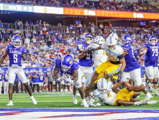 Sep 4, 2026: Kansas Jayhawks running back Yasin Willis (6) breaks a tackle and scores a touchdown against Long Island Sharks in Lawrence, KS, USA; at Memorial Stadium. Mandatory Credit: -Cal Media NCAA, College League, USA Football 2026: LIU Vs Kansas SEP 04  - ZUMAc04_ 20260904_zma_c04_037 Copyright: xRomanxPunox