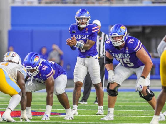 Sep 4, 2026: Kansas Jayhawks quarterback Isaiah Marshall (8) looks on prior to snapping the ball against Long Island Sharks in Lawrence, KS, USA; at Memorial Stadium. Mandatory Credit: -Cal Media NCAA, College League, USA Football 2026: LIU Vs Kansas SEP 04  - ZUMAc04_ 20260904_zma_c04_040 Copyright: xRomanxPunox