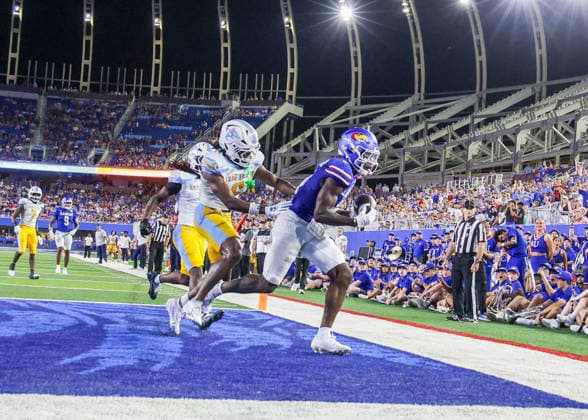 Sep 4, 2026: Kansas Jayhawks wide receiver Nik McMillan (5) scores a touchdown against Long Island Sharks in Lawrence, KS, USA; at Memorial Stadium. Mandatory Credit: -Cal Media NCAA, College League, USA Football 2026: LIU Vs Kansas SEP 04  - ZUMAc04_ 20260904_zma_c04_043 Copyright: xRomanxPunox