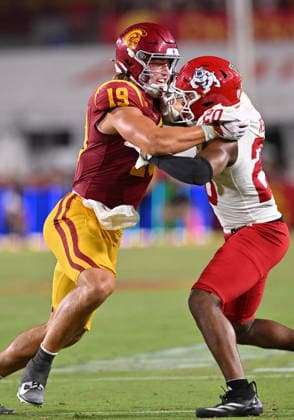 LOS ANGELES, CA - SEPTEMBER 04: Southern California Trojans tight end Mark Bowman (19) blocks Fresno State Bulldogs defensive back R.J. Regan (20) during the game between the USC Trojans and the Fresno State Bulldogs on September 04, 2026 at Los Angeles Memorial Coliseum in Los Angeles. (Photo by David Dennis Icon Sportswire) COLLEGE FOOTBALL: SEP 04 Fresno State at USC EDITORIAL USE ONLY Icon26090429