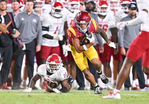 LOS ANGELES, CA - SEPTEMBER 04: Southern California Trojans wide receiver Zacharyus Williams (0) shakes a tackle during the game between the USC Trojans and the Fresno State Bulldogs on September 04, 2026 at Los Angeles Memorial Coliseum in Los Angeles. (Photo by David Dennis Icon Sportswire) COLLEGE FOOTBALL: SEP 04 Fresno State at USC EDITORIAL USE ONLY Icon26090437