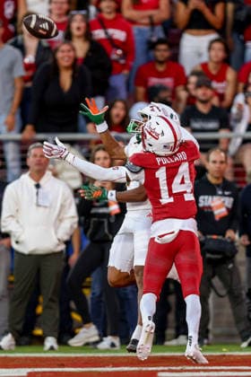 PALO ALTO, CA - SEPTEMBER 04: Stanford Cardinal wide receiver Dre Pollard (14) attempts to break up a pass Miami Hurricanes wide receiver Daylyn Upshaw (7) makes a catch for a touchdown during a college football game between the Miami Hurricanes and Stanford Cardinal on September 4, 2026 at Stanford Stadium in Palo Alto, CA. (Photo by Trinity Machan Icon Sportswire) COLLEGE FOOTBALL: SEP 04 Miami at Stanford EDITORIAL USE ONLY Icon260904000163240