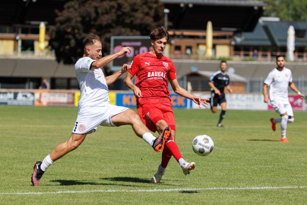 Tizian Zimmermann 22, TSV Buchbach, and Jeton Abazi 9, TSV Landsberg, during the match between TSV Landsberg and TSV Buchbach, soccer, men s, Bavarian Regional League, 2026–2027, Matchday 7 on September 5, 2026, in Landsberg am Lech, Sportpark, Bavaria, Germany