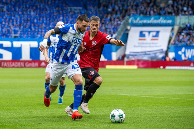 Rostock, Germany September 5, 2026 3rd League 2026–2027 Match 4: FC Hansa Rostock vs. SV Wehen Wiesbaden Pictured from left in a tackle: Leon Dajaku (Hansa Rostock) and Gino Fechner (SV Wehen Wiesbaden). DFB and DFL regulations prohibit any use of photographs as image sequences and or quasi-video Copyright: xFotostandx xVoelkerx