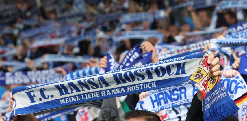 FC Hansa Rostock vs. Wehen Wiesbaden, Rostock, September 5, 2026, Soccer 3rd Division: FC Hansa Rostock vs. Wehen Wiesbaden. FC Hansa Rostock in the headlines; here, fans wearing scarves at the Rostock Ostseestadion in Mecklenburg-Western Pomerania, Germany