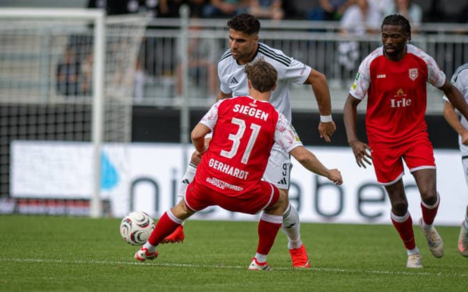 Soccer, 2026–2027 Season, Regionalliga West, September 5, 2026, Matchday 7, Men’s, 1 FC Bocholt (white) vs. Sportfreunde Siegen (red), v l s32 Malek Fakhro (1 FC Bocholt), Matono Glody Ngyombo (SF Siegen), Bocholt Stadion am Huenting, Germany 260905_fb_1fc-bocholt_sf-siegen_58419
