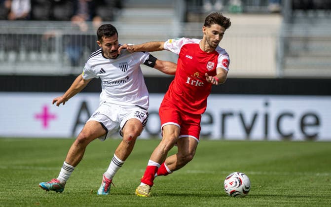 Soccer, 2026–2027 Season, Regionalliga West, September 5, 2026, Matchday 7, Men’s, 1 FC Bocholt (white) vs. Sportfreunde Siegen (red); from left: Marvin Lorch (1 FC Bocholt), Elsamed Ramaj (SF Siegen); Bocholt Stadion am Huenting, Germany 260905_fb_1fc-bocholt_sf-siegen_58423