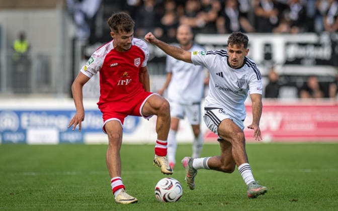 Soccer, 2026–2027 Season, Regionalliga West, September 5, 2026, Matchday 7, Men’s, 1 FC Bocholt (white) vs. Sportfreunde Siegen (red); from left: Tim Arnold (SF Siegen), Filip Ilic (1 FC Bocholt); Bocholt Stadion am Huenting, Germany 260905_fb_1fc-bocholt_sf-siegen_58449