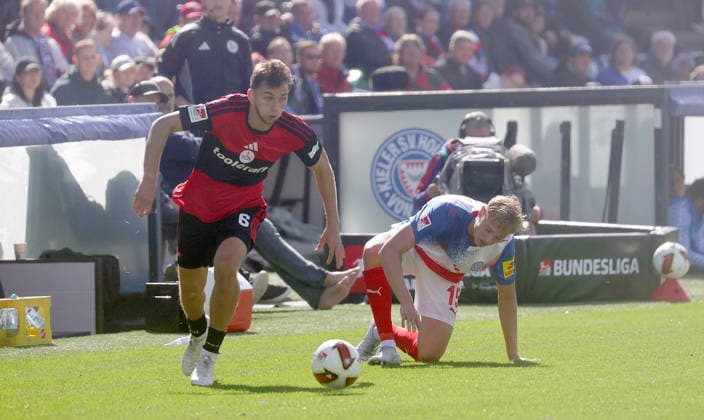 Adam Mrkhiev (1.FC Nuernberg), Kasper Davidsen (Holstein Kiel) Fussball, Herren, Saison 2026 2027, 2.BL, Holstein Stadion, Holstein Kiel gegen 1.FC Nuernberg, 2-2 DFL REGULATIONS PROHIBIT ANY USE OF PHOTOGRAPHS AS IMAGE SEQUENCES AND OR QUASI-VIDEO. *** Adam Mrkhiev, 1. FC Nuremberg; Kasper Davidsen, Holstein Kiel Soccer, Men s Division, 2026–2027 Season, 2. Bundesliga, Holstein Stadium, Holstein Kiel vs. 1. FC Nuremberg, 2–2. DFL regulations prohibit any use of photographs as image sequences and or quasi-video.
