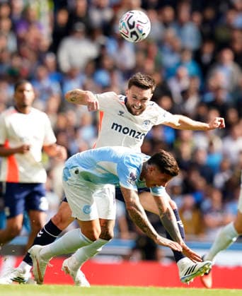Manchester, England, 5th September 2026. Matt Grimes of Coventry City challenges Enzo Fernandez of Manchester City during the Manchester City vs Coventry City Premier League match at the Etihad Stadium, Manchester. Picture credit should read: Andrew Yates Sportimage EDITORIAL USE ONLY. No use with unauthorised audio, video, data, fixture lists, club league logos or live services. Online in-match use limited to 120 images, no video emulation. No use in betting, games or single club league player publications. SPI_010_AY_MAN_CITY_COVENTRY SPI-4970-0010