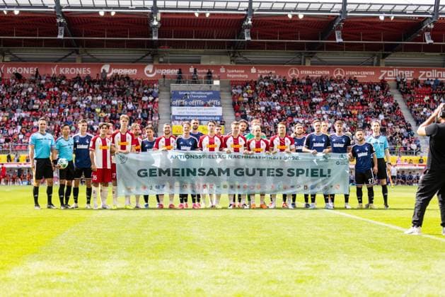 September 5, 2026, Soccer, GER, Season, 3rd Division, 2026–2027 Season, Matchday 4, SSV Jahn Regensburg vs. MSV Duisburg. Players from both teams hold up a banner reading Let’s Play a Good Game Together before the match. DFL REGULATIONS PROHIBIT ANY USE OF PHOTOGRAPHS AS IMAGE SEQUENCES AND OR QUASI-VIDEO