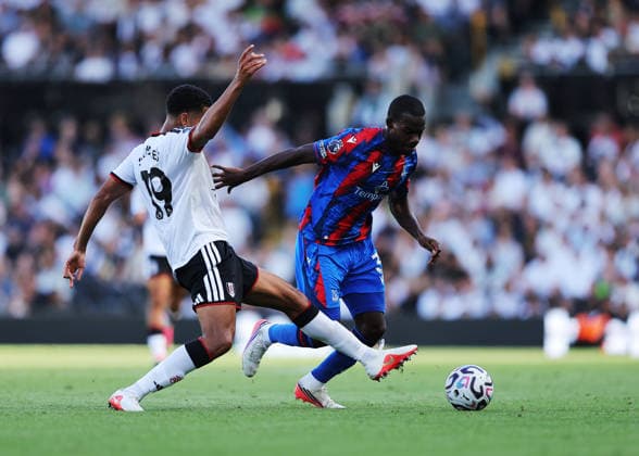 5th September 2026; Craven Cottage, Fulham, London, England; Premier League Football, Fulham versus Crystal Palace; Tyrick Mitchell of Crystal Palace under pressure from Shea Charles of Fulham JohnxPatrickxFletcher