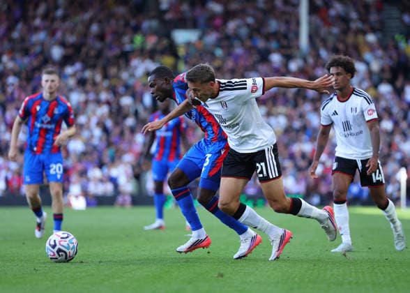 5th September 2026; Craven Cottage, Fulham, London, England; Premier League Football, Fulham versus Crystal Palace; Tyrick Mitchell of Crystal Palace under pressure from Timothy Castagne of Fulham JohnxPatrickxFletcher