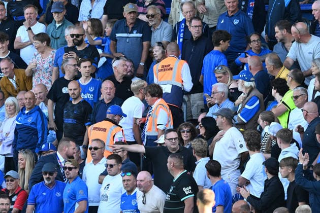 Portsmouth v Cardiff City, EFL Sky Bet Championship Two fans are removed by supervisors after an altercation with Krystian Bielik (5) of Cardiff City during the EFL Sky Bet Championship match between Portsmouth and Cardiff City at Fratton Park, Portsmouth, UK on 5 September 2026. Portsmouth Fratton Park Hampshire UK Editorial use only DataCo restrictions apply See www.football-dataco.com , Copyright: xGrahamxHuntx PSI-24809-0099