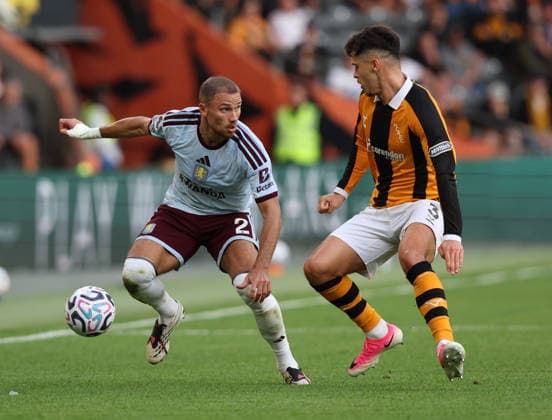 Kingston upon Hull, England, 5th September 2026. Ryan Giles (R) of Hull City in action with Matty Cash of Aston Villa during the Hull City vs Aston Villa Premier League match at the MKM Stadium, Kingston upon Hull. Picture credit should read: Nigel Roddis Sportimage EDITORIAL USE ONLY. No use with unauthorised audio, video, data, fixture lists, club league logos or live services. Online in-match use limited to 120 images, no video emulation. No use in betting, games or single club league player publications. SPI_011_NR_HULL_ASTO SPI-4974-0011