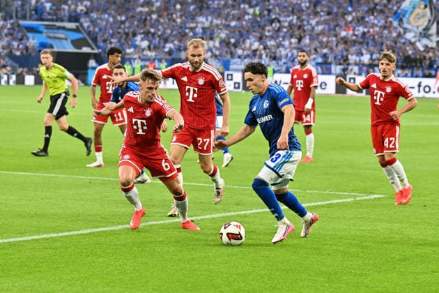 GELSENKIRCHEN, GERMANY; 05. SEPTEMBER: tackle between Joshua KIMMICH (FC Bayern Munich 6) and Soufiane EL-FAOUZI (FC Schalke 23) during the Bundesliga Match between FC Schalke 04 vs. FC Bayern Munich at Matchday 2 at Veltins Arena DFL REGULATIONS PROHIBIT ANY USE OF PHOTOGRAPHS AS IMAGE SEQUENCES AND OR QUASI-VIDEO Copyright: xBEAUTIFULxSPORTS Goldbergx