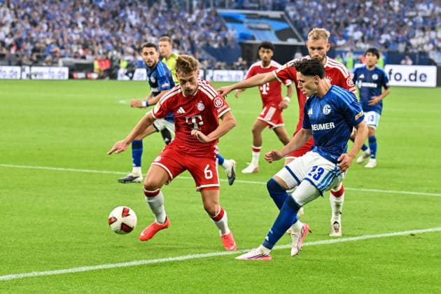 GELSENKIRCHEN, GERMANY; 05. SEPTEMBER: tackle between Joshua KIMMICH (FC Bayern Munich 6) and Soufiane EL-FAOUZI (FC Schalke 23) during the Bundesliga Match between FC Schalke 04 vs. FC Bayern Munich at Matchday 2 at Veltins Arena DFL REGULATIONS PROHIBIT ANY USE OF PHOTOGRAPHS AS IMAGE SEQUENCES AND OR QUASI-VIDEO Copyright: xBEAUTIFULxSPORTS Goldbergx
