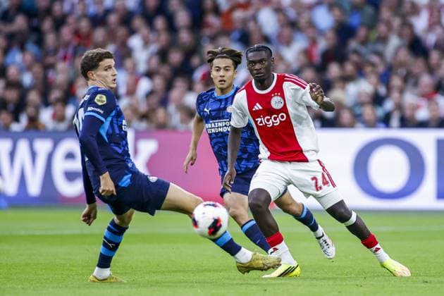 AMSTERDAM , 05-09-2026, JohanCruijff ArenA , season 2026 2027 , Dutch Eredivisie Football Match between Ajax and PSV. Picture shows PSV Player Guus Til, PSV Player Kodai Sano and Ajax player Jorthy Mokio Ajax - PSV  x206514139x Copyright: