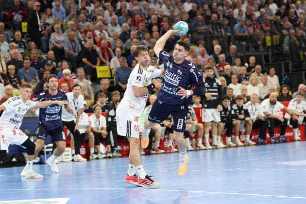 September 5, 2026, xBHAx, Handball, Opel HBL, 2026–2027 season, 1st HBL, SG Flensburg-Handewitt vs. HC Erlangen, GGW Arena: Aymeric Minne of SG Flensburg-Handewitt scores 44 on an attack against Florian Scheerer of HC Erlangen; 10 Schleswig-Holstein German