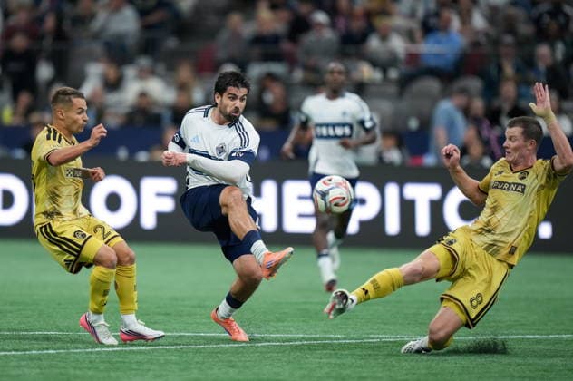 September 5, 2026, Vancouver, Bc, CANADA: Vancouver Whitecaps Brian White, centre, has his shot blocked by St. Louis City s Chris Durkin, right, as Alexandru Matan, left, watches during the second half of an MLS, Fussball Herren, USA soccer match, in Vancouver, on Saturday, Sept. 5, 2026. Canada News - September 5, 2026  - ZUMAc35_ 20260905_zaf_c35_131 Copyright: xDarrylxDyckx